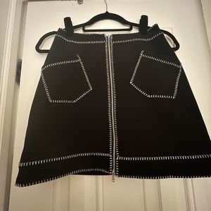 Classic black mini skirt with a twist.